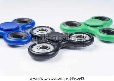 Group of fidget spinner stress relieving toy isolated on white background.