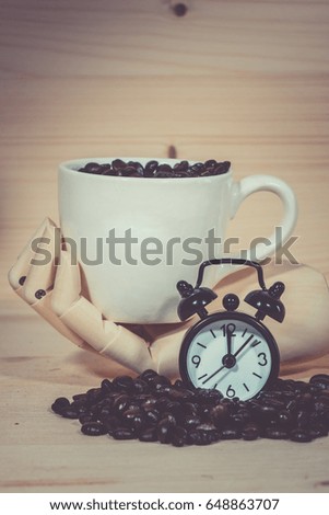 Clock  Alarm  ,Coffee cup full of coffee beans with on wooden desk