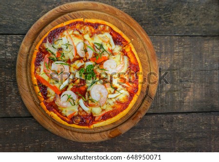 Spicy Seafood Pizza on food table                               