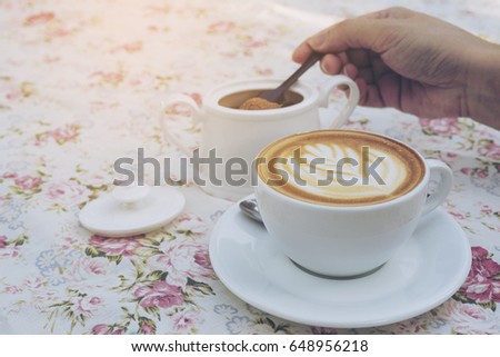 Vintage picture of lady is taking sugar for preparing hot coffee