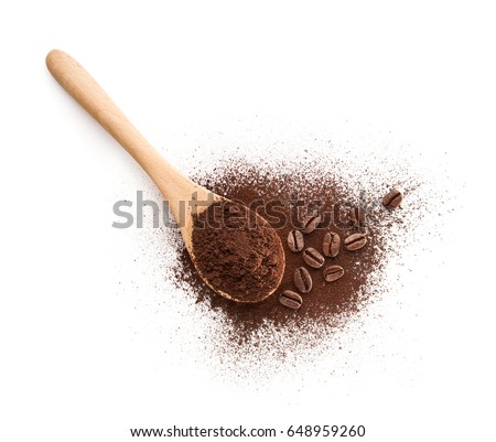 Wooden Spoon filled with coffee powder isolated on white background Royalty-Free Stock Photo #648959260