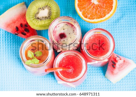 Jars with smoothies and fruits 