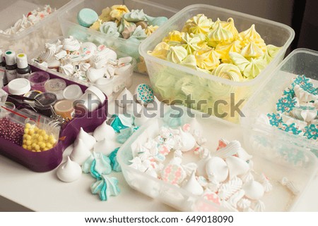 Industrial concept about food, mini colorful meringues in boxes for Confectionary decoration