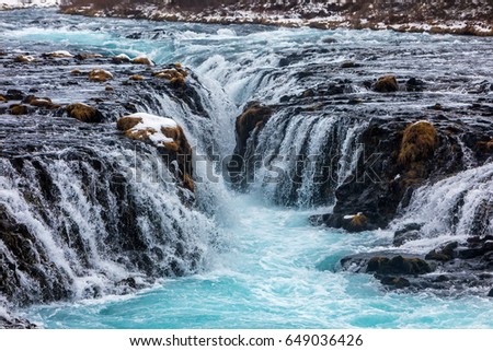 beautiful Bruarfoss waterfall with turquoise water in winter, South Iceland