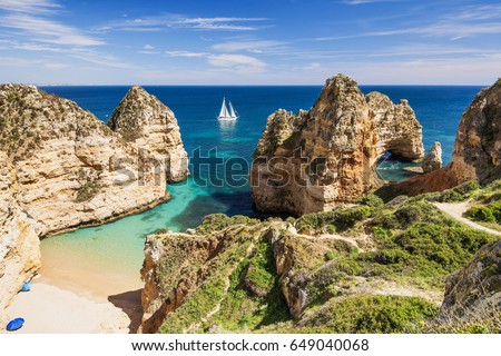 Beautiful bay near Lagos town, Algarve region, Portugal. Sandy beach. Popular travel destination Royalty-Free Stock Photo #649040068