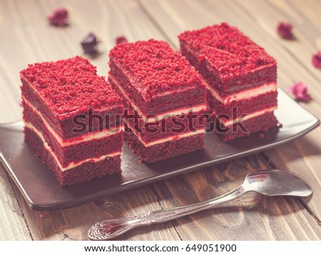 Red velvet cake on wood board in soft tone