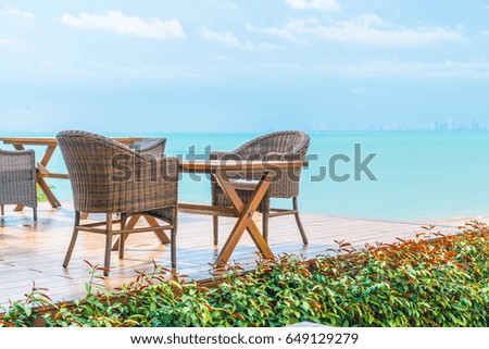 Outdoor patio chair and table with sea background