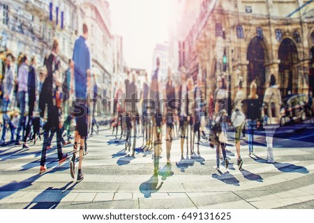 Silhouettes of people at pedestrian crossing