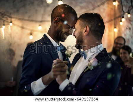 Newlywed Gay Couple Dancing on Wedding Celebration Royalty-Free Stock Photo #649137364