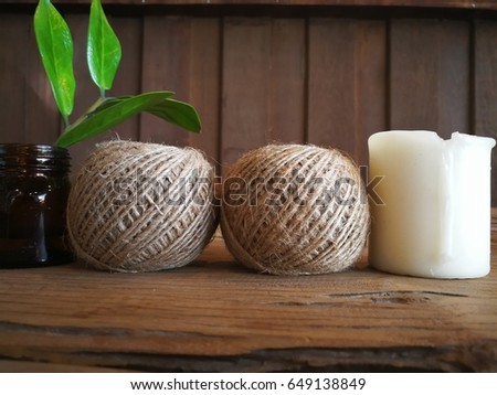 hemp rope three candle and orchid flower on mat for spa