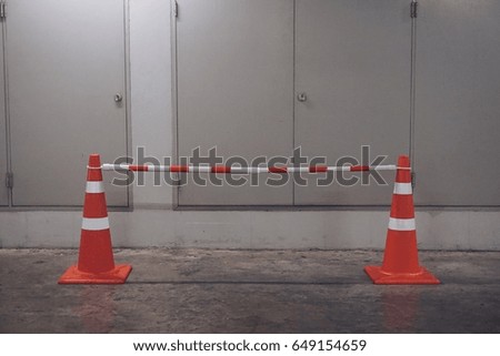 traffic cones and barrier in the parking area