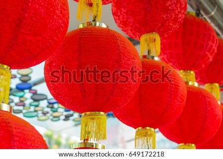 Traditional red lantern hanging in Chinese Temple.