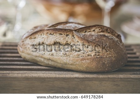 Country bread on wooden board