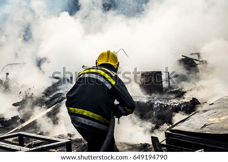 Firefighter extinguishes fire