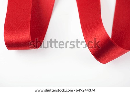 Abstract shapes with red fabric ribbon. Isolated. Copy space.