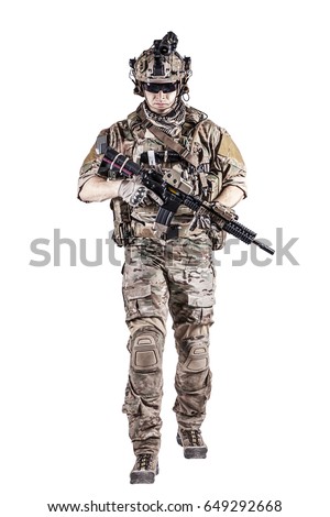 US Army rangers in combat uniforms with his shirt sleeves rolled up, in helmet, eyewear and night vision goggles moving walking towards camera. Studio shot, white background