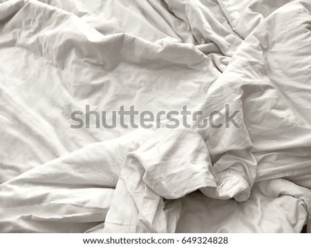 Close up white wrinkle messy blanket on bed. Concept sleep in the long night and after wake up in the morning