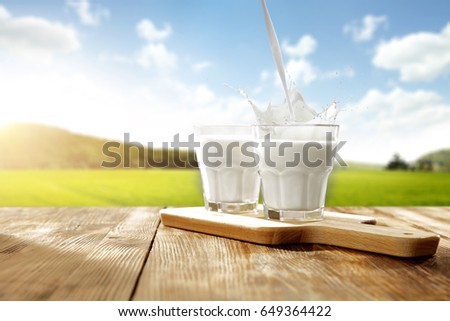 milk splash and wooden table of free space for your decoration 