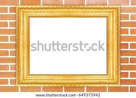 Classic gold frame isolate on red brick wall background.