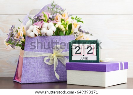 Calendar cubes 22 June Still Life with Flowers and gifts concept day