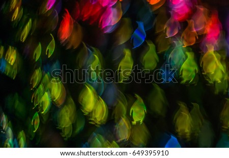 Blurry light in the shape of a penguin, different colors of lights, abstraction, background, animal
