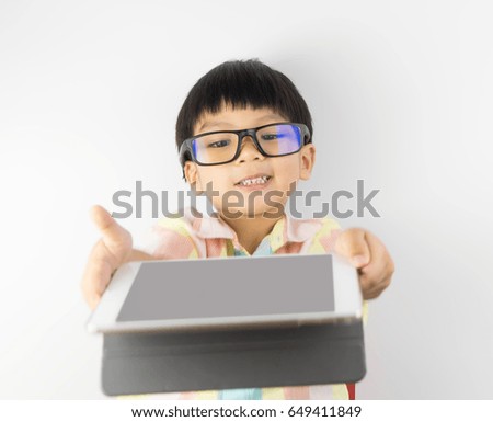 Asian Nerdy boy is showing you blank tablet screen