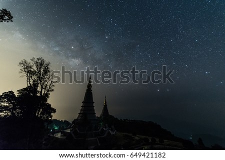 milky way over Phramahathat Napamathanidol and Phramahathat Napaphol Bhumisiri Pagoda at Doi Inthanon National Park, Chiangmai, Thailand.