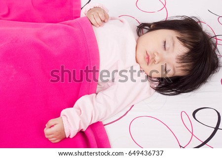 Adorable little girl sleeping on the bed are sleep time.