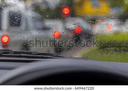 Silhouette edge The rain is falling. Bokeh on the road in the morning. In Thailand.Abstract blurred background : Traffic jam in the morning rush hour. in-Thailand Bokeh on the road in Thailand.