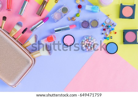 Colorful make up products material design flat lay scene with copy space