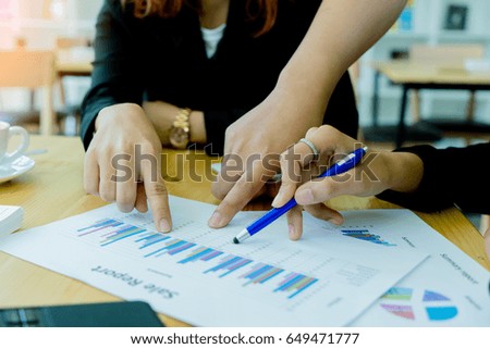 Team of business  investment consultant analyzing company annual financial report balance sheet statement working with documents graphs. Concept picture of economy, market, office, money and tax