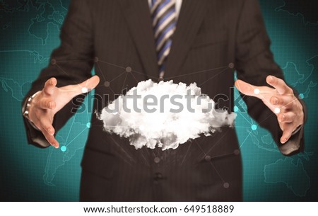 Elegant business person holding an empty white cloud in its hands in front of green wall background with world map illustration concept