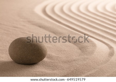 spa wellnes relaxing background with stone in raked sand