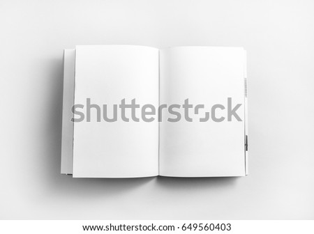 Blank open book, brochure or magazine on paper background. Mock-up for graphic designers portfolios. Responsive design mockup. Top view.