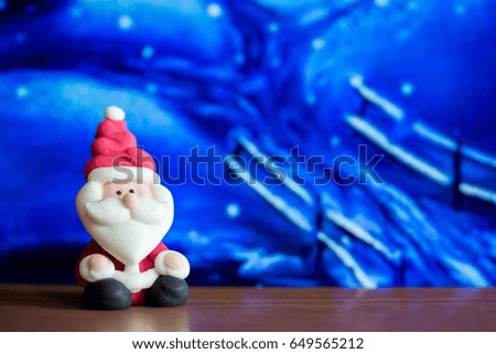 Santa Claus doll in house background.Colorful Christmas Symbol .Using as wallpaper or backgrounds.Ready for Merry Christmas