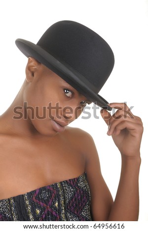 Gorgeous fashion model holding a hat isolated on white