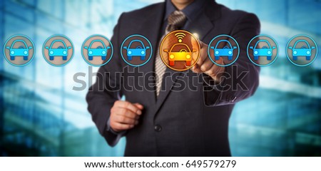 Blue chip automobile designer selecting a connected auto in a lineup. Concept for autonomous or driverless car, vehicle tracking system, artificial intelligence and vehicular communication systems. Royalty-Free Stock Photo #649579279