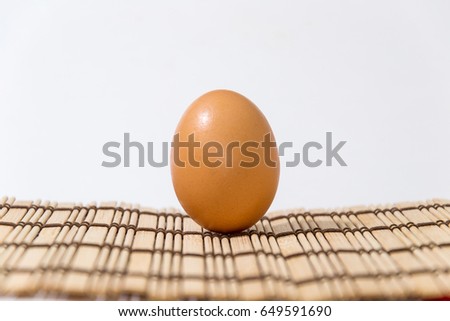 One chicken egg on the table