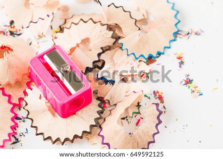 Sharpener and color pencil trash on white background