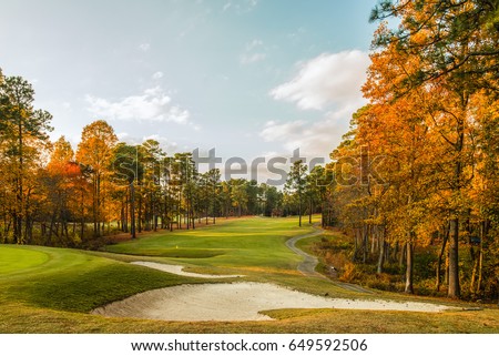 Photo of a golf course in North Carolina in the fall when the leaves have turned a brilliant orange color