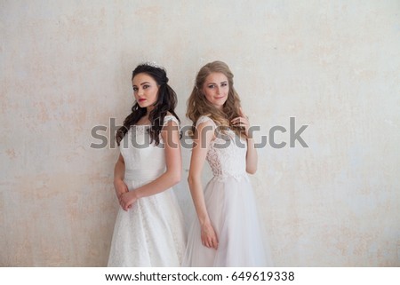 two brides in wedding dresses wedding blonde brunette