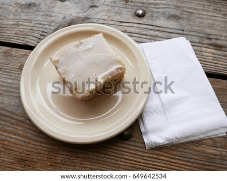 Lemon cake with napkin on the wooden table