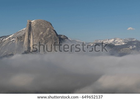 Black Streaked Dome-shot of half dome, above the clouds, from Glacier Point, in Yosemite National Park