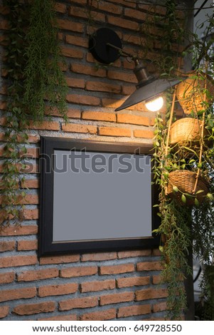 Old Picture Frame Decorated On Brick Wall, stock photo