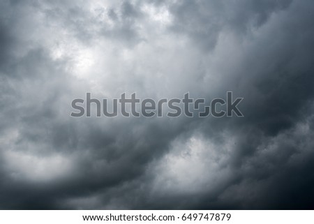 clouds with background,sunlight through very dark clouds background of dark storm clouds, black sky Background of dark clouds before a thunder.