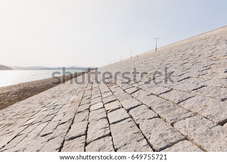 Stone dyke of Yantai Reservoir which is the important water resource of Yantai city. Shandong province, China.