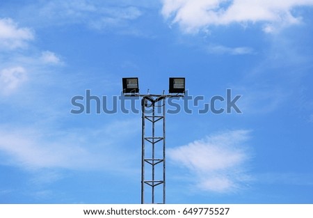 Telecommunication tower isolated on blue sky clouds abstract background. Broadcasting antenna on blue sky closeup background
