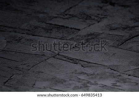 Dark grey grunge rough concrete texture wall.