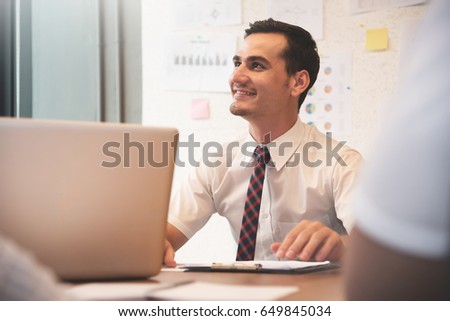 Confident Businessman smiling with working at the office.