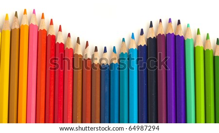 extreme closeup of crayons wave on white background